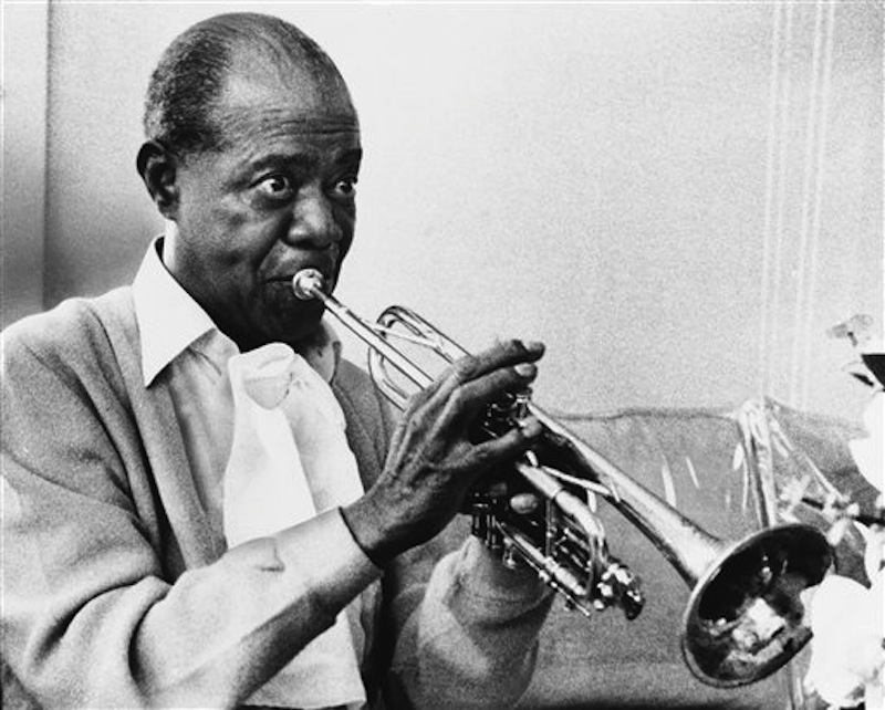In a June 21, 1971 file photo jazz great Louis Armstrong practices with his horn at his Corona, New York home on June 21, 1971. A live recording of Louis Armstrong playing his trumpet for one of the last times is being played Friday April 27, 2012 at the National Press Club in Washington where it was created in January 1971. (AP Photo/Eddie Adams, File) Looking Away Holding Trumpet Practicing Fame Musician