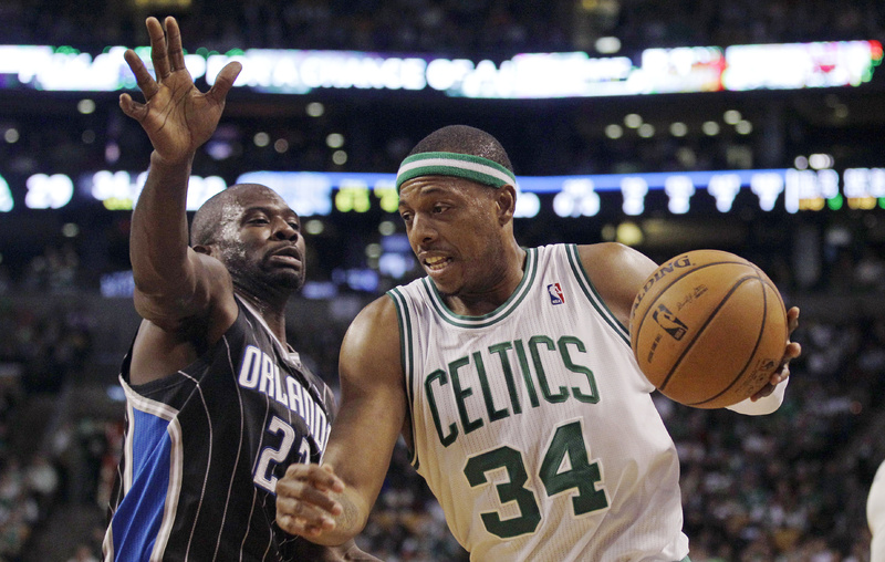 Celtics forward Paul Pierce drives to the basket past Magic guard Jason Richardson during Wednesday's game in Boston. The Celtics won, 102-98.