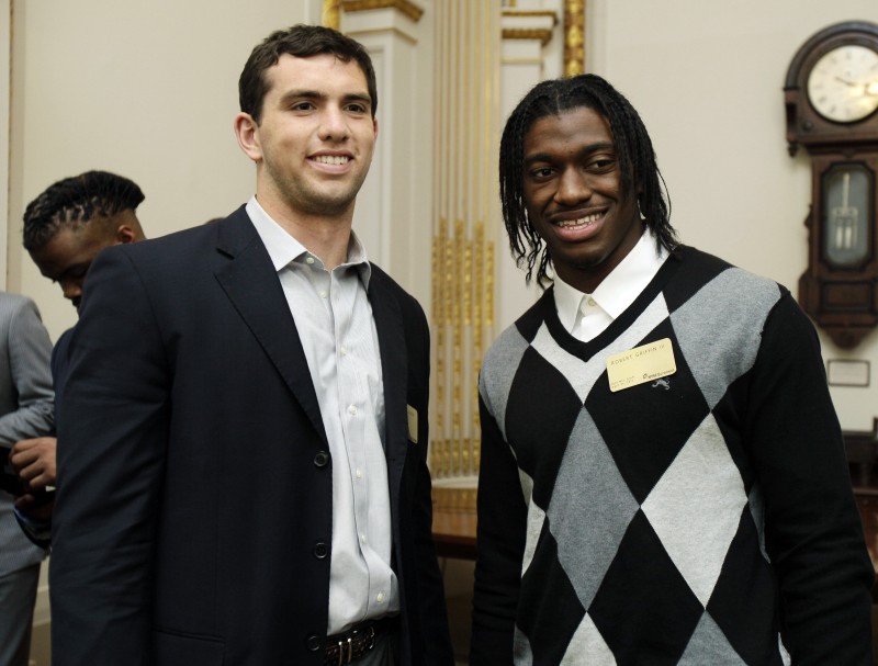 NFL football draft prospects Andrew Luck, left, of Stanford, and Robert Griffin III, of Baylor, attend a reception during their visit to the trading floor of the New York Stock Exchange on Wednesday.