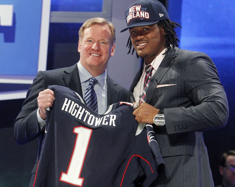 Alabama's Dont'a Hightower, right, poses for photographs with NFL Commissioner Roger Goodell after being selected 25th overall by the New England Patriots in the first round of the NFL football draft on Thursday.