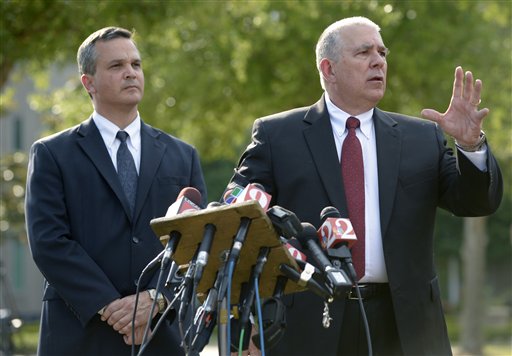 Hal Uhrig, right, and Craig Sonner, former attorneys for George Zimmerman, speak to reporters during a news conference in Sanford, Fla., on Tuesday to announce they had quit as Zimmerman's legal representatives.