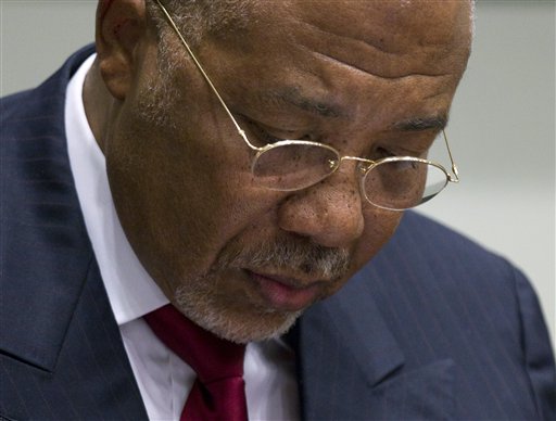 Former Liberian President Charles Taylor looks down as he waits for the start of a hearing to deliver a verdict in Leidschendam, near The Hague, Netherlands.