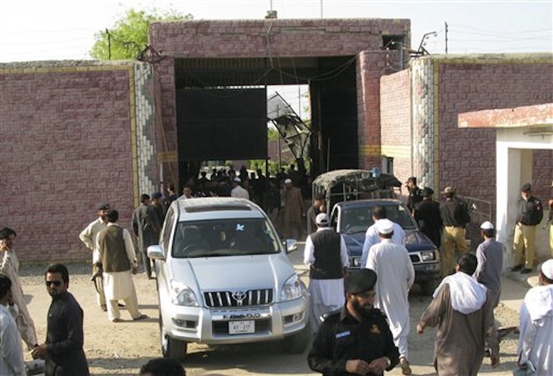 Pakistani security officials visit the central jail in Bannu, 170 kilometer (106 miles) south of Peshawar, Pakistan on Sunday, April 15, 2012. Taliban militants battled their way into the prison on Sunday, freeing close to 400 prisoners, including at least 20 described by police as "very dangerous" insurgents, authorities and the militants said. (AP Photo/Ijaz Muhammad)