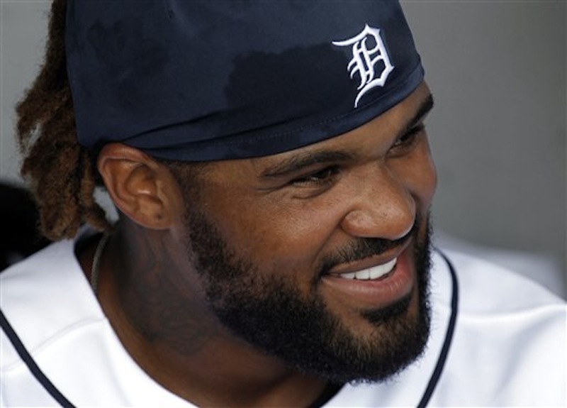 Detroit Tigers first baseman Prince Fielder smiles in the dugout against the New York Yankees during a spring training baseball game in Lakeland, Fla. on Saturday, March 24, 2012. (AP Photo/Paul Sancya)