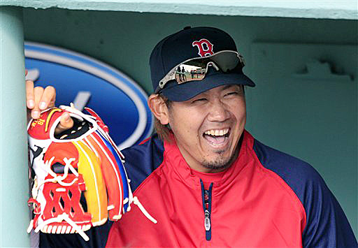 Boston Red Sox pitcher Daisuke Matsuzaka laughs in the dugout prior to a game against the Texas Rangers at Fenway Park last week.