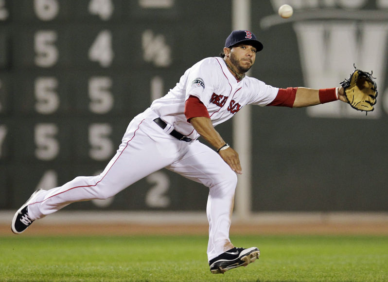 Boston Red Sox shortstop Mike Aviles cannot make a play on a single by Texas Rangers' Nelson Cruz during the third inning tonight at Fenway Park in Boston.