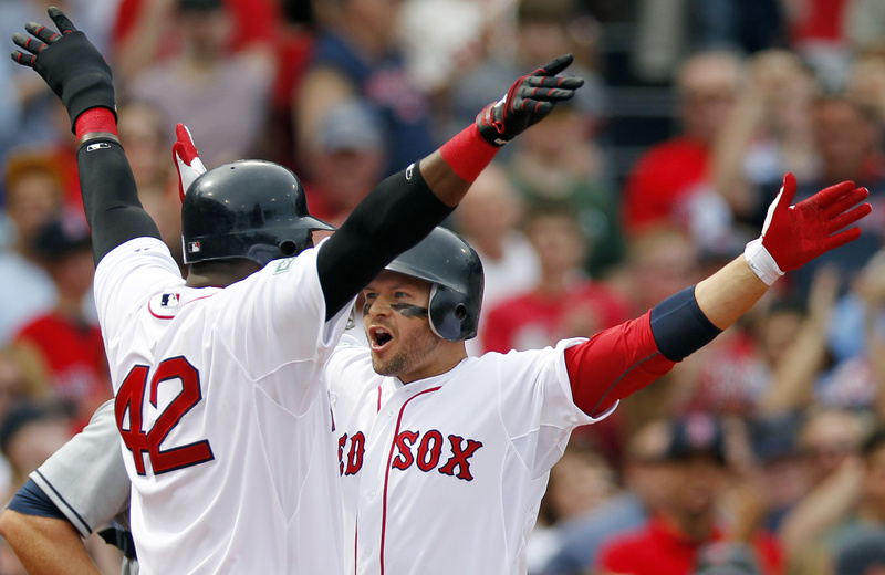 Boston's Cody Ross, right, celebrates his three-run home run with teammate David Ortiz in the second inning of Sunday's game against the Tampa Bay Rays in Boston. The Red Sox won, 6-4.