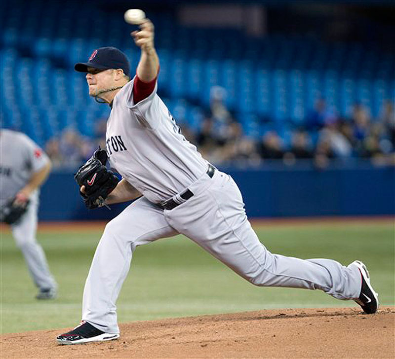 Boston Red Sox starting pitcher Jon Lester throws against the Toronto Blue Jays in first inning of a baseball game in Toronto on Wednesday, April 11, 2012. Despite only surrendering three hits, the Sox lost 3-1. (AP Photo/The Canadian Press, Frank Gunn) baseball;American;AL;athlete;athletes;athletic;athletics;Canada;
