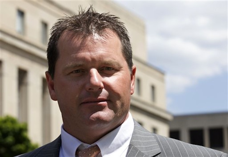 Former Major League Baseball pitcher Roger Clemens leaves federal court in Washington, Tuesday, April 24, 2012. Clemens' lawyer opened his defense of the former pitching star by telling jurors that evidence purportedly showing Clemens used steroids was manipulated by his former strength coach, Brian McNamee. (AP Photo/Manuel Balce Ceneta)