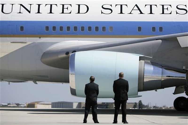 In this Saturday, Oct. 4, 2008 file photo, Secret Service agents watch as Air Force One departs Midland International Airport with President Bush and first lady Laura Bush aboard in Midland, Texas. (AP Photo/Matt Slocum)