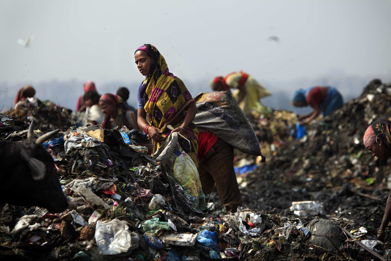 Rag pickers, as they are called, scavenge for food and recyclable materials inside New Delhi’s 70-acre, 100-foot-high Ghazipur landfill. Families earn $1 to $2 per day and many live in shanties ringing the dump.