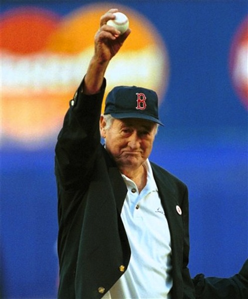 In this June 11, 1999 file photo, Boston Red Sox Hall of Famer Ted Williams winds up to throw out the ceremonial first pitch before a baseball game between the Red Sox game and the New York Mets in New York. (AP Photo/Bill Kostroun, File)