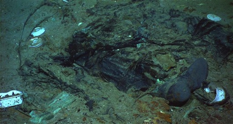 This photo provided by the Institute for Exploration, Center for Archaeological Oceanography/University of Rhode Island/NOAA Office of Ocean Exploration, shows The remains of a coat and boots, articulated in the mud on the sea bed near Titanic's stern, are suggestive evidence of where a victim of the disaster came to rest. (AP Photo/Institute for Exploration, Center for Archaeological Oceanography/University of Rhode Island/NOAA Office of Ocean Exploration)