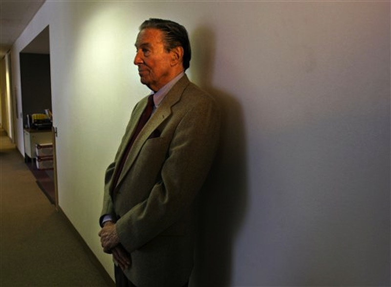 This May 8, 2006 file photo shows Mike Wallace, veteran CBS " 60 Minutes" correspondent, waiting in a hallway near his office to see a colleague in New York, Monday May 8, 2006. Wallace, famed for his tough interviews on "60 Minutes," has died, Saturday, April 7, 2012. He was 93. (AP Photo/Bebeto Matthews)
