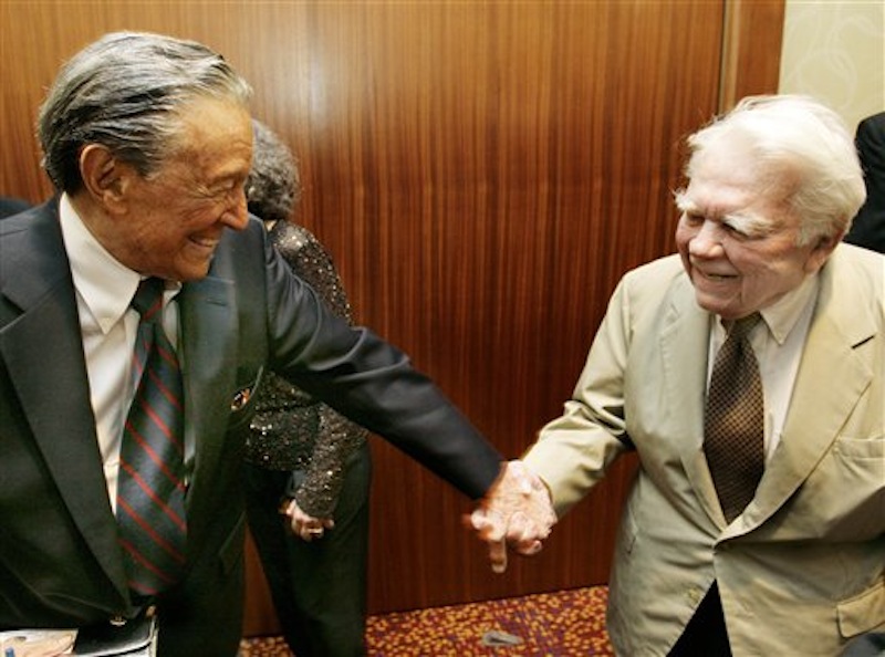 In this May 12, 2007 photo CBS' 60 Minutes' Mike Wallace, left, greets colleague Andy Rooney during a reception at the 30th annual Boston/New England Emmy Awards in Boston. Wallace, famed for his tough interviews on "60 Minutes," has died, Saturday, April 7, 2012. He was 93. (AP Photo/CN8, Michael Dwyer)