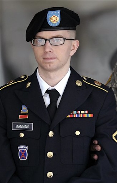 In this March 15, 2012 file photo, Army Pfc. Bradley Manning departs a courthouse in Fort Meade, Md. Manning is accused of engineering the biggest leak of government secrets in U.S. history, including sensitive diplomatic cables and a video where U.S. soldiers shoot civilians from an Apache helicopter. (AP Photo/Cliff Owen)