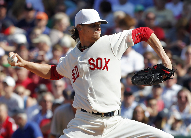 Clay Buchholz pitches in the first inning of the Red Sox's game against the New York Yankees in Boston on Friday. To celebrate the 100th birthday of Fenway Park, players wore uniforms replicating the ones worn in 1912.