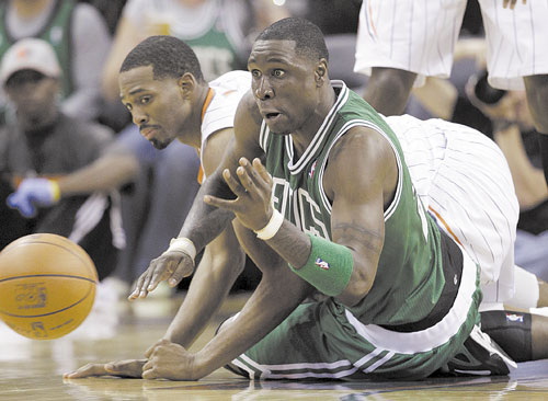 Boston’s Mickael Pietrus and Charlotte’s Derrick Brown chase a loose ball during the second half Sunday in Charlotte, N.C.
