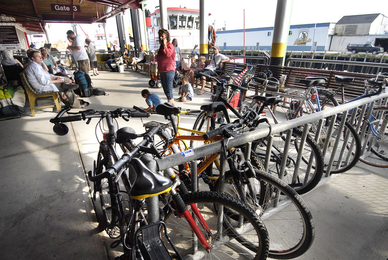 Bicycles await commuters at the Casco Bay Lines terminal on Commercial Street. Biking and walking are becoming more popular ways to get around town.