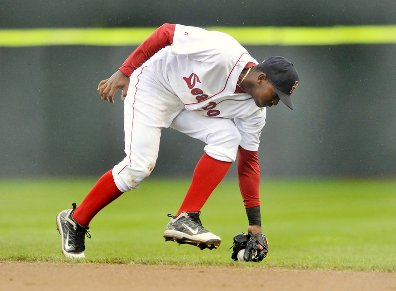 Sea Dogs second baseman Oscar Tejeda prepares fields a ground ball. Tejeda had a home run in Sunday's 4-2 loss to Reading, as Portland remained in last place.