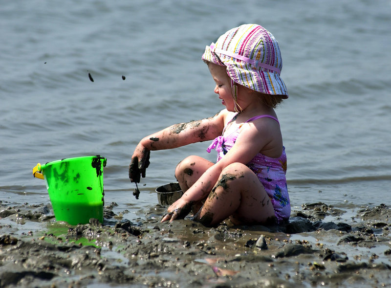 A toddler makes the most of some mud on an outing to Mackworth Island.