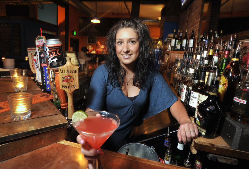 Heather Piela tends bar at Empire Dine & Dance, which offers something extra to do most nights.