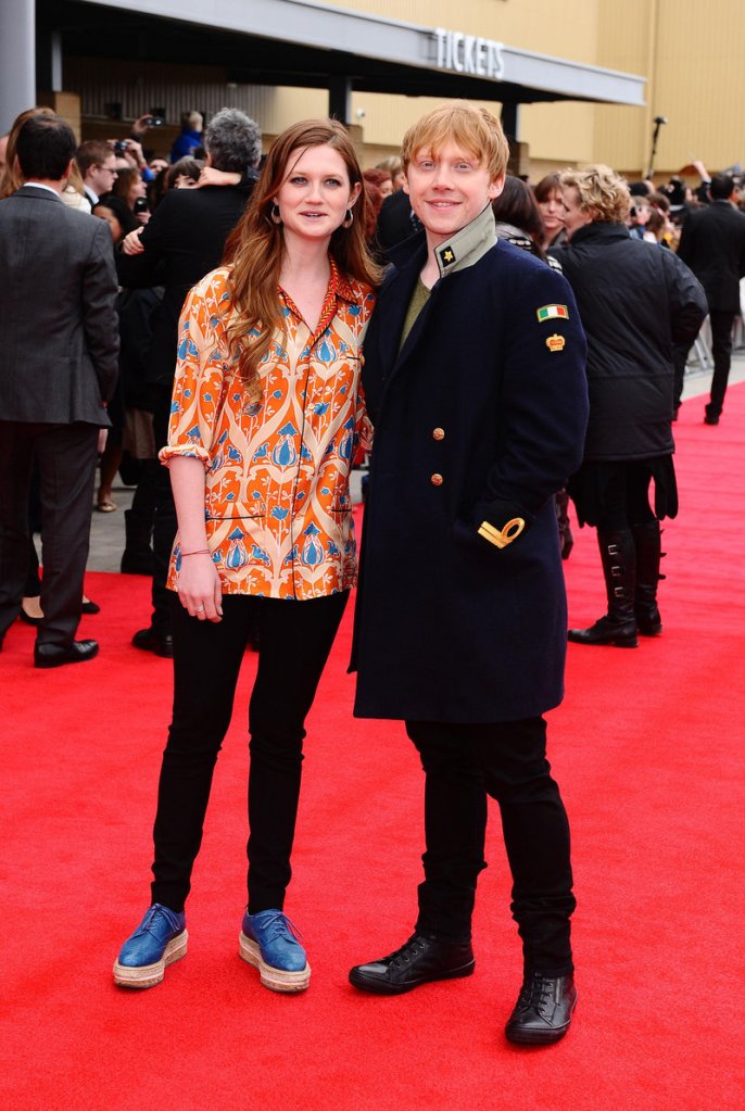 Bonnie Wright and Rupert Grint arrive at the grand opening of the Warner Brothers studio tour “The Making of Harry Potter,” at the Leavesdon Studios in London on Saturday. The studio tour is nirvana for Harry Potter fans and for film geeks, who can watch designers talk about their work in short films, ride a broomstick in the green-screen effects room and see how makeup, prosthetics and animatronics brought hundreds of magical creatures to life in the Harry Potter movies.