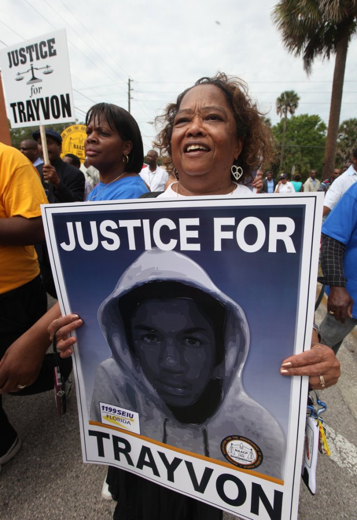 Andre Frison joins thousands of other protesters in a march and rally for slain Florida teenager Trayvon Martin on Saturday in Sanford, Fla.