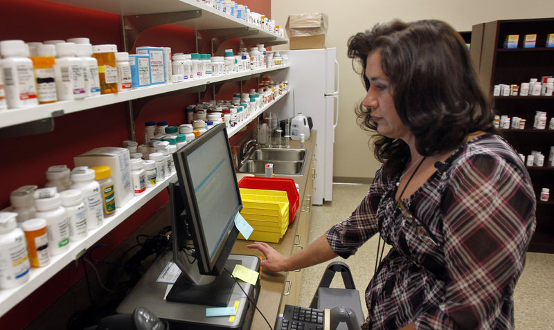 Terry Kroh, pharmacy director at Duquesne University’s Center for Pharmacy Services, fills a prescription at the Pittsburgh store, where the focus is solely on patient care. “It’s not a browse-the-aisles pharmacy,” with soft drinks and candy for sale, said J. Douglas Bricker, Duquesne School of Pharmacy dean.
