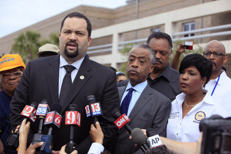 Benjamin Jealous, president of the NAACP, talks to the media as the Revs. Al Sharpton and Jesse Jackson, back, listen before a rally for slain Florida teenager Trayvon Martin last month in Sanford, Fla. As in other high-profile cases, the media presents what evidence it can gather, but experts caution that the public gets an incomplete picture.