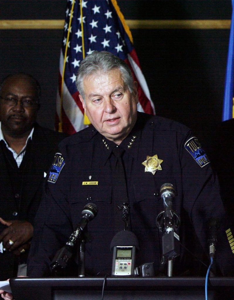 Chief of Police Chuck Jordan holds a news conference Saturday in downtown Tulsa, Okla. Police believe a series of early-morning shootings in which three black people were killed and two others wounded may be linked.