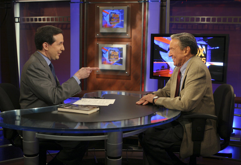 “Fox News Sunday” host Chris Wallace, left, interviews his father, Mike Wallace, in 2005 in New York.