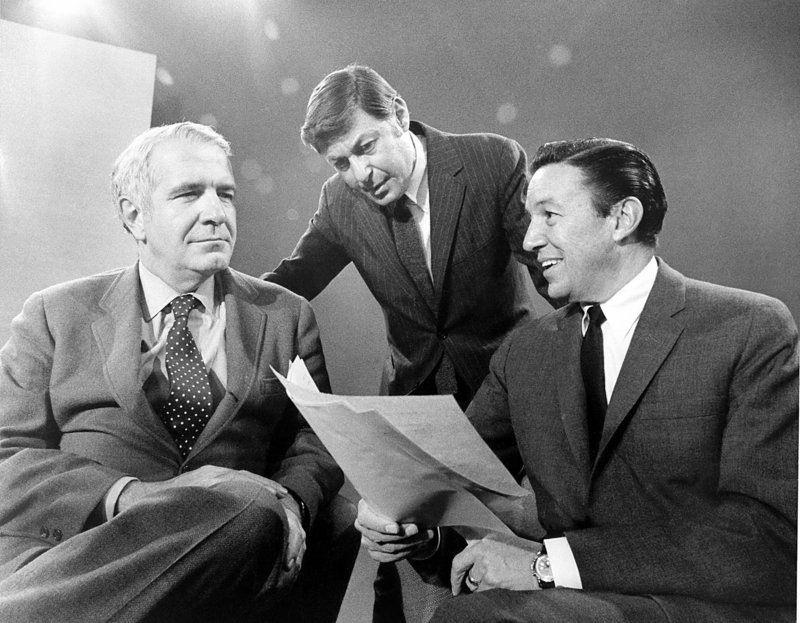 “60 Minutes” correspondents Harry Reasoner, left, and Mike Wallace, right, are shown with producer Don Hewitt on the set in New York in 1968.