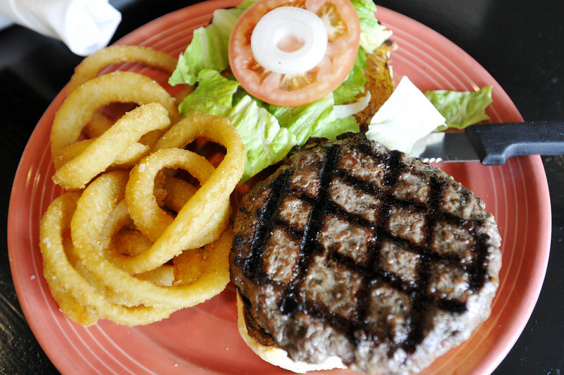 A burger and onion rings at Shays Grill Pub in Portland.