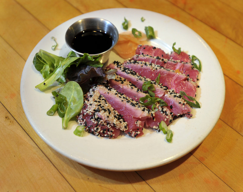 A plate of sesame-crusted tuna, seared rare.