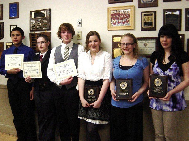 Winners of the Lions Club Regional Speak-Out Contest pose with their plaques and certificates. Pictured from left are: Honorable Mention winners August Mendoza, Elise Piet, and Matthew Gile, third place winner Olivia Bradley, second place winner Mariah Arral and first place winner Sequoia Booth. Piet is from Sanford High School, all others are Massabesic High School students.
