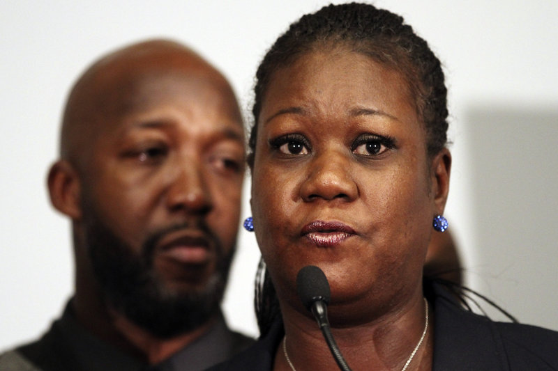 Trayvon Martin’s parents, Tracy Martin, left, and Sybrina Fulton, speak to the media on Wednesday in Washington about the arrest of George Zimmerman in the killing of their son. Zimmerman is charged with second-degree murder.