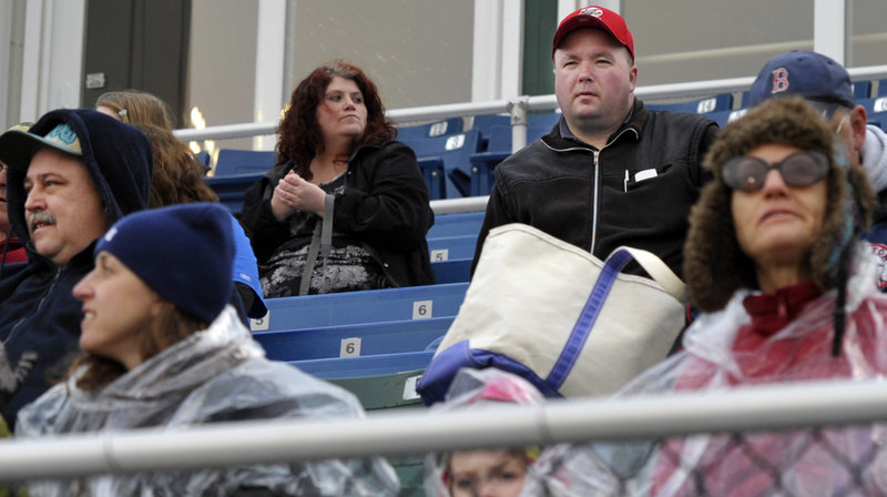 Kevin Davison waits for the Portland Sea Dogs’ Opening Day game to start Thursday. He drove nine hours from his hometown of Halifax, Nova Scotia.