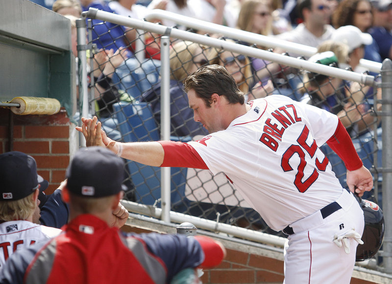 Bryce Brentz returns to the dugout after scoring on a double in the fourth inning Saturday at Hadlock Field. The Sea Dogs beat the Binghamton Mets, 5-3.