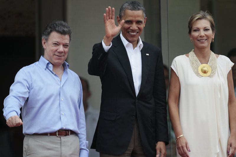 President Obama is flanked by Colombian President Juan Manuel Santos, left, and Santos’ wife, first lady Maria Clemencia Rodriguez, in Cartagena, Colombia, on Saturday.