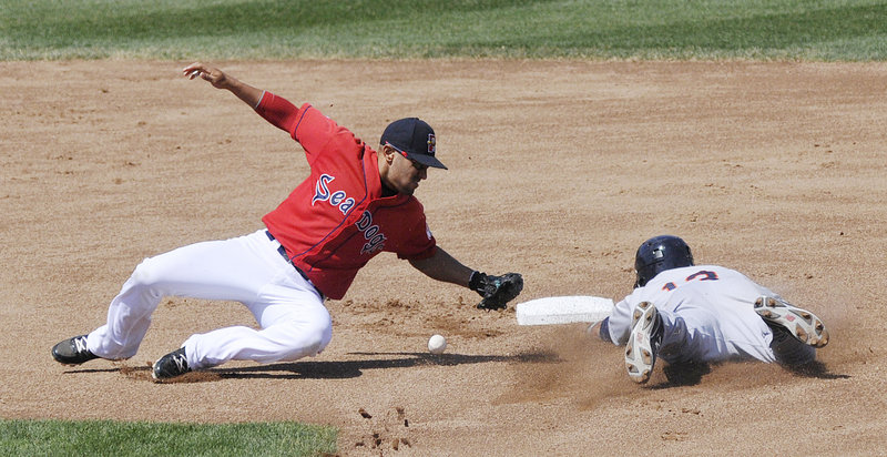 Sea Dogs second baseman Ryan Dent can’t hold on to the ball as he attempts to tag Binghamton’s Juan Lagares on a stolen-base attempt Sunday at Hadlock Field. Binghamton earned a split of the four-game series with a 9-2 victory.