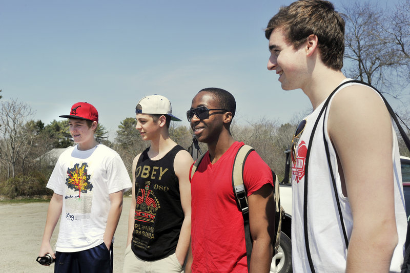 South Portland High School students, from left, Trevor Fenwick, Nick Fagone, Sacre Bahati and Josh McDuffy, said Monday they were unaware of the proposed parking fee increase at Higgins Beach. They said they would now think twice about paying for a parking spot there.