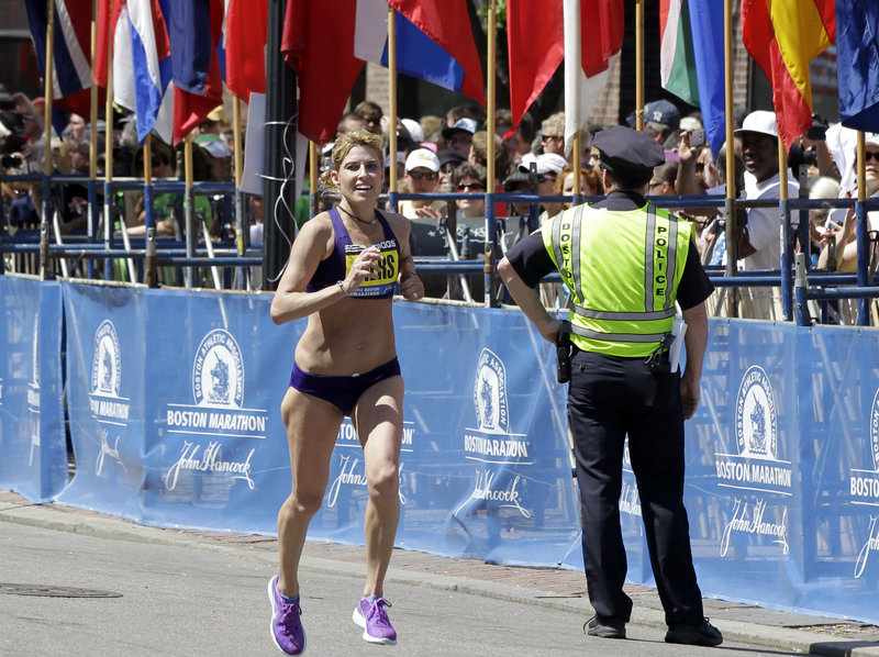 Sheri Piers of Falmouth approaches the finish Monday in a standout Boston Marathon performance. She won $9,200 as the second female masters runner and 10th woman overall.