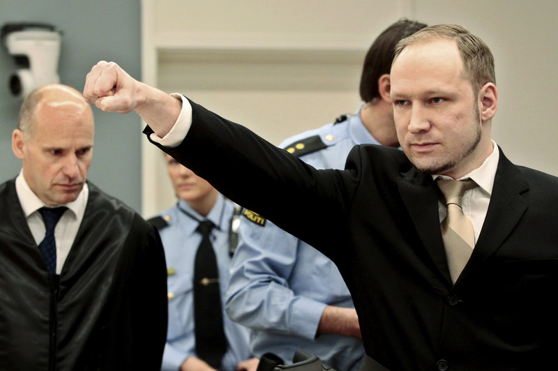 Accused mass killer Anders Behring Breivik gestures as he arrives in a courtroom in Oslo, Norway, on Monday.