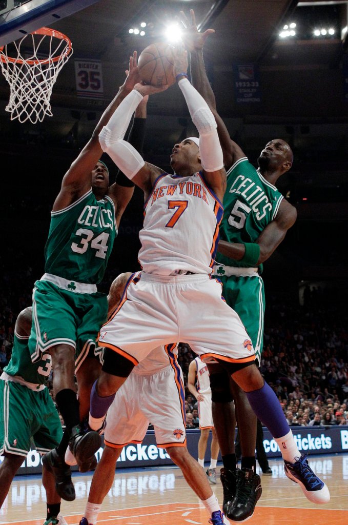Paul Pierce, left, and Kevin Garnett of the Boston Celtics look for a way to stop Carmelo Anthony, who had 35 points Tuesday for the Knicks.