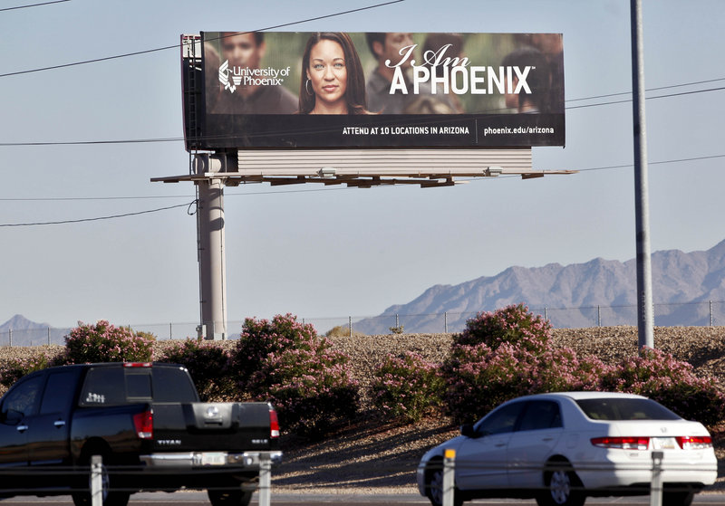 A University of Phoenix billboard from 2009 seeks students for the for-profit college in Chandler, Ariz. Those colleges use a large portion of their revenues for recruiting students.