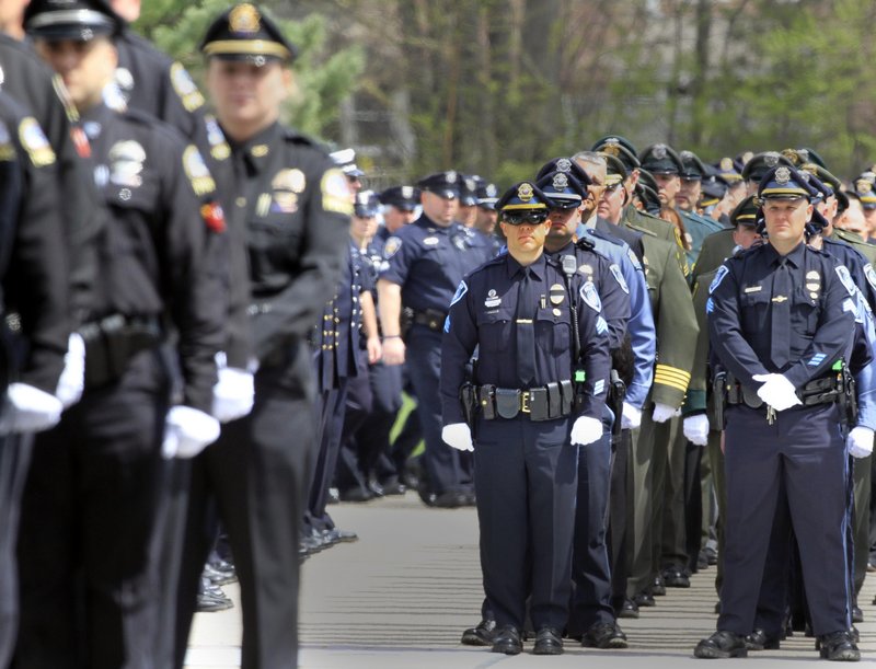 Hundreds of law enforcement officers line up Wednesday to pay their respects to Greenland, N.H., Police Chief Michael Maloney, who was killed last week while trying to serve a warrant.