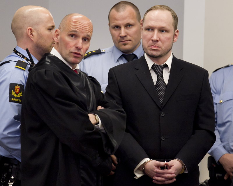 Anders Behring Breivik, right, stands with lawyer Geir Lippestad on the third day of his trial Wednesday in Oslo, Norway. Breivik is charged with killing 77 people in 2011.