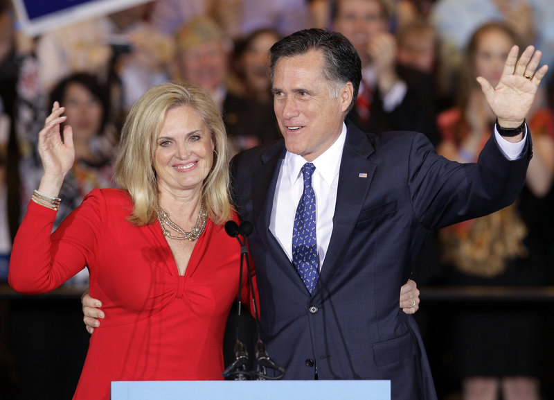 Former Massachusetts Gov. Mitt Romney and his wife, Ann, wave as they leave an election night rally in Schaumburg, Ill., after winning the Illinois primary.