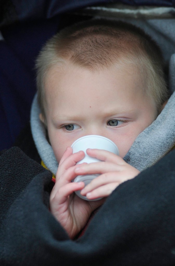 Jacob Tuttle, 2, of Portland, samples a smoothie.